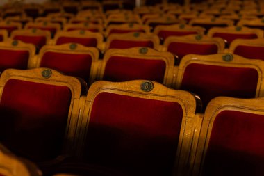 Row of red seats in theatre for design purpose