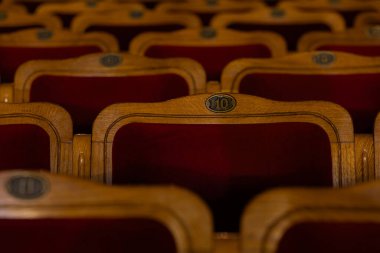 Row of red seats in theatre for design purpose