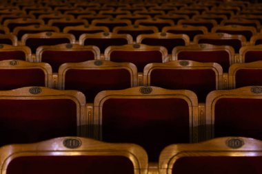 Row of red seats in theatre for design purpose