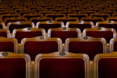 Row of red seats in theatre for design purpose