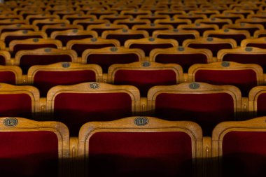 Row of red seats in theatre for design purpose