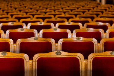 Row of red seats in theatre for design purpose