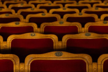 Row of red seats in theatre for design purpose