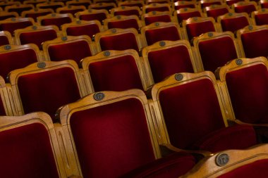 Row of red seats in theatre for design purpose