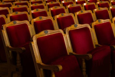 Row of red seats in theatre for design purpose