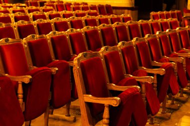 Row of red seats in theatre for design purpose