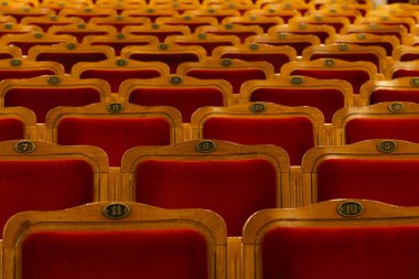 Row of red seats in theatre for design purpose