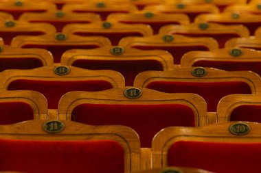 Row of red seats in theatre for design purpose
