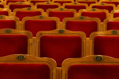 Row of red seats in theatre for design purpose