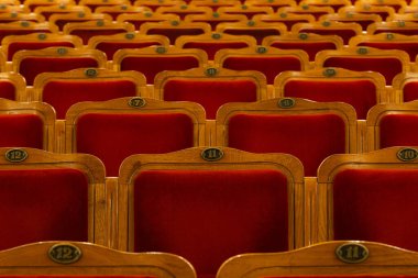 Row of red seats in theatre for design purpose