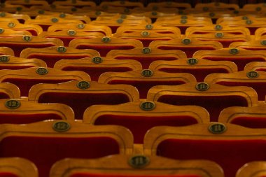 Row of red seats in theatre for design purpose
