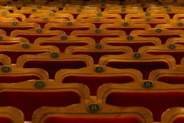 Row of red seats in theatre for design purpose