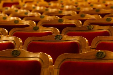Row of red seats in theatre for design purpose