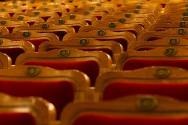 Row of red seats in theatre for design purpose