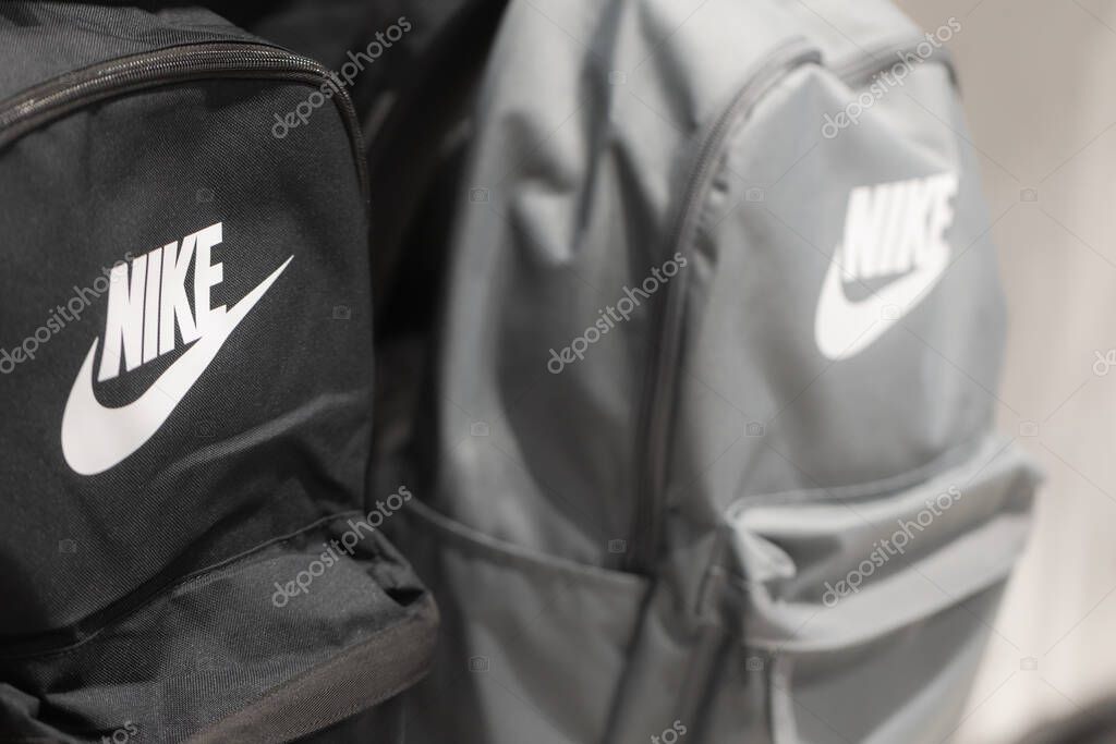 Lviv, Ukraine - May 30, 2025 Close-up of Black and Grey Nike Backpacks with White Logo