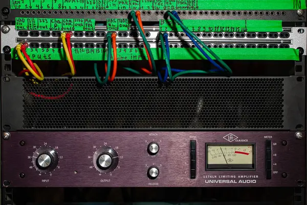 Lviv, Ukrayna - 25 Mayıs 2019.Audio Rack with Patch Panel and Universal Audio 1176LN Limiting Amplifier