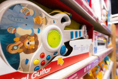 Lviv, Ukraine - April 16, 2025:Colorful Toy Guitar, Kids Musical Instrument