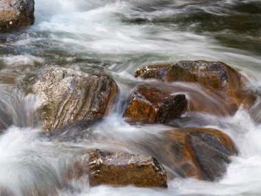 Beautiful waterfall with blurred crystalline waters photographed in long exposure. Selective Focus