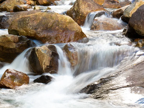 Beautiful waterfall with blurred crystalline waters photographed in long exposure. Selective Focus