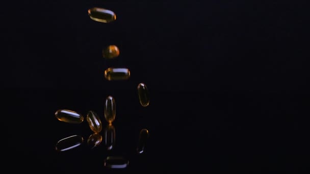 Omega Fish Oil Dietary Supplement Falling Glossy Black Background Omega — Stok video