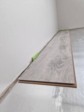 Close up of laminate flooring plank ready for flooring installation