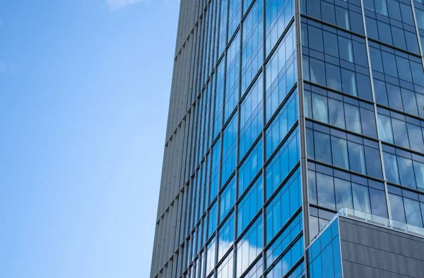 stock image Modern glass facade. Bottom view of a building in the business district. Glass facade of an office building