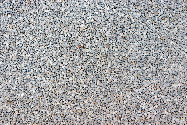 小さな石の背景 軽い砂利道小石のテクスチャ 庭の小石と抽象的な背景 砂利の表面パターン — ストック写真