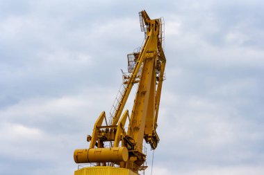 Harbor ondustry equipment. Port crane. Loading or unloading concept.  Transport, shipping port