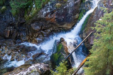 Mickiewicz waterfall near the road to Morskie Oko lake. Waterfall known as Wodogrzmoty Mickiewicza. Tatra Mountains, Poland