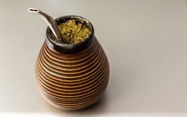 Yerba mate matero. Sout America popular hot drink. Couple drinking healthy herbal beverage