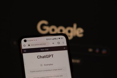 Warsaw Poland - February 24, 2023: OpenAI ChatGPT vs Google concept. Chat bot GPT on smartphone and Google logo background