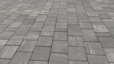 Gray paving stones. Paving surface road. Texture made of big gray cement bricks. Brick stone street road - pavement texture effect