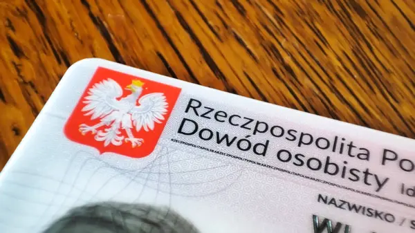 stock image Warsaw Poland - July 1 2024:Closeup of a Polish ID card showing detailed information and design elements.