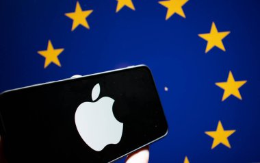 Warsaw Poland - September 20 2024: A smartphone displaying the Apple logo against a backdrop of EU stars symbolizing technology and global connections. clipart