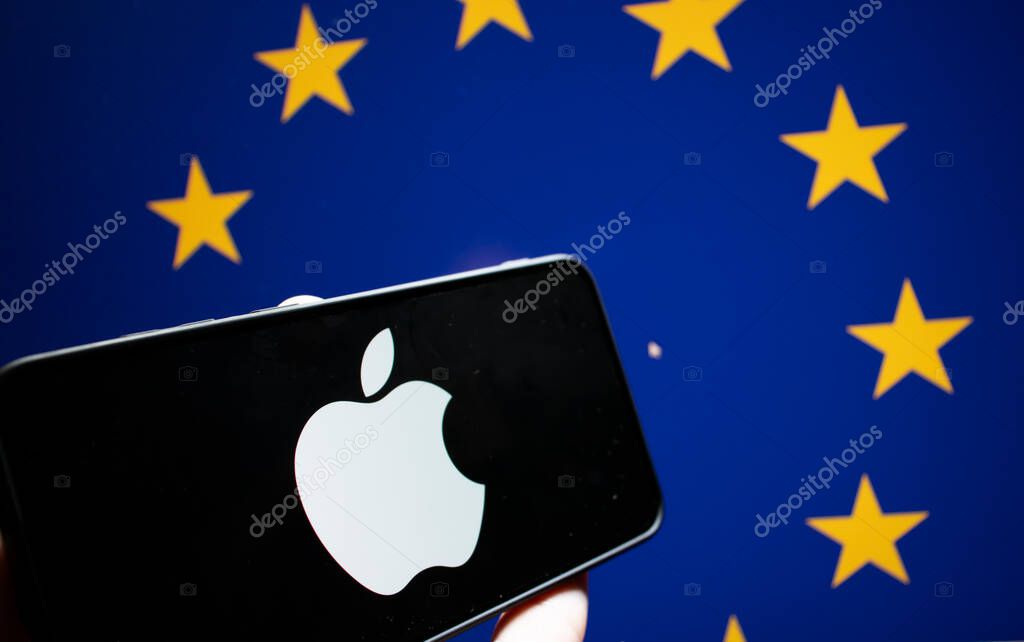 Warsaw Poland - September 20 2024: A smartphone displaying the Apple logo against a backdrop of EU stars symbolizing technology and global connections.