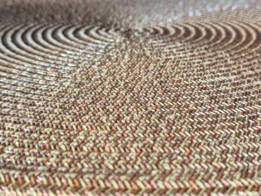 Dokuma dokularının doğal bir desen oluşturan toprak tonlarında yakın çekim. Tasarım projeleri için ideal.