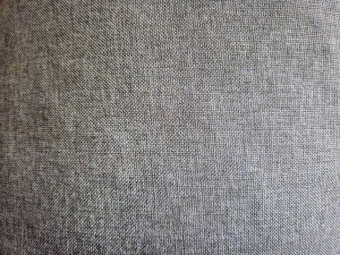 Arkaplan veya tasarım projeleri için ideal gri tonlu kumaşın yakın plan görüntüsü.