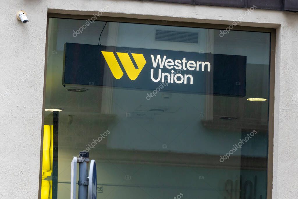 Wroclaw Poland - February 23 2025: Western Union logo displayed on the storefront representing a global money transfer service and financial services provider.