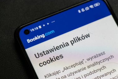 Warsaw Poland - September 16 2025: Close-up of a smartphone screen displaying Booking.com cookies settings in Polish. Illustrative and editorial image showcases digital navigation.