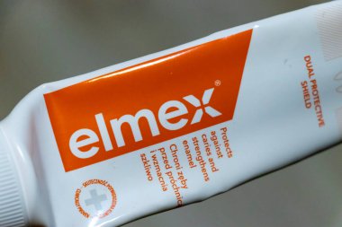 Warsaw Poland - September 24 2025: Close-up of elmex toothpaste tube featuring a protective shield for dental care. This product helps prevent cavities and strengthen enamel.