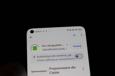 Warsaw Poland - September 24 2025: A smartphone screen displaying a language learning application with notification messages and various interactive features.