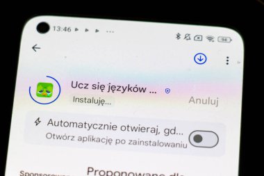 Warsaw Poland - September 24 2025: Close-up view of a smartphone screen displaying an app installation process for a language learning application.