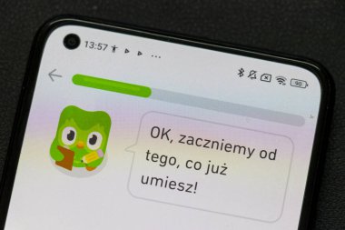 Warsaw Poland - September 24 2025: A close-up of a smartphone screen displaying the Duolingo app interface illustrating language learning concepts and user engagement.