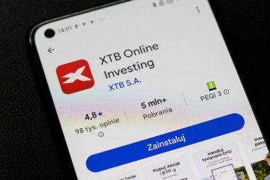 Warsaw Poland - September 24 2025: Close-up of XTB Online Investing mobile app interface displayed on a smartphone showcasing its features and ratings.