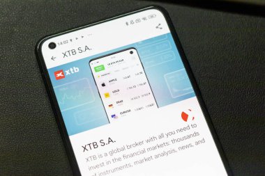 Warsaw Poland - September 24 2025: Display of XTB S.A. mobile application showcasing financial data and trading options for various instruments and analysis.