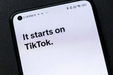 Warsaw Poland - September 24 2025: Close-up of smartphone screen displaying the text It starts on TikTok showcasing modern digital communication during the social media era.
