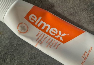 Warsaw Poland - September 24 2025: Close-up of Elmex toothpaste tube highlighting its protective formula and dental care benefits for healthy gums and teeth.