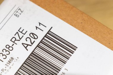 Warsaw Poland - September 24 2025: Close-up of a barcode label on a cardboard box used for scanning items during shipping and inventory management in warehouses.