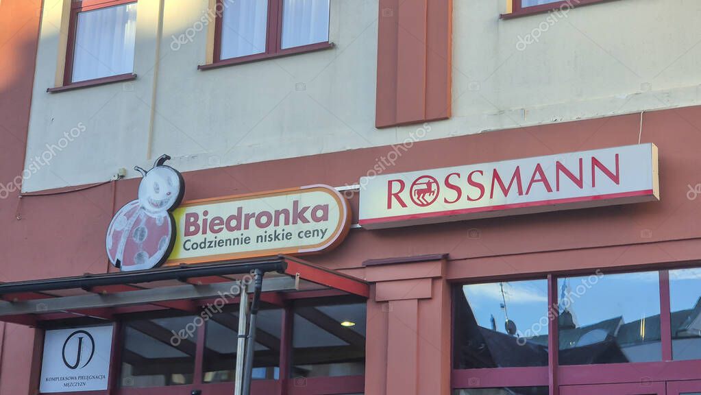 Rzeszow Poland - September 15 2025: Signboard of Biedronka and Rossmann stores featuring bright colors and branding at a shopping location.