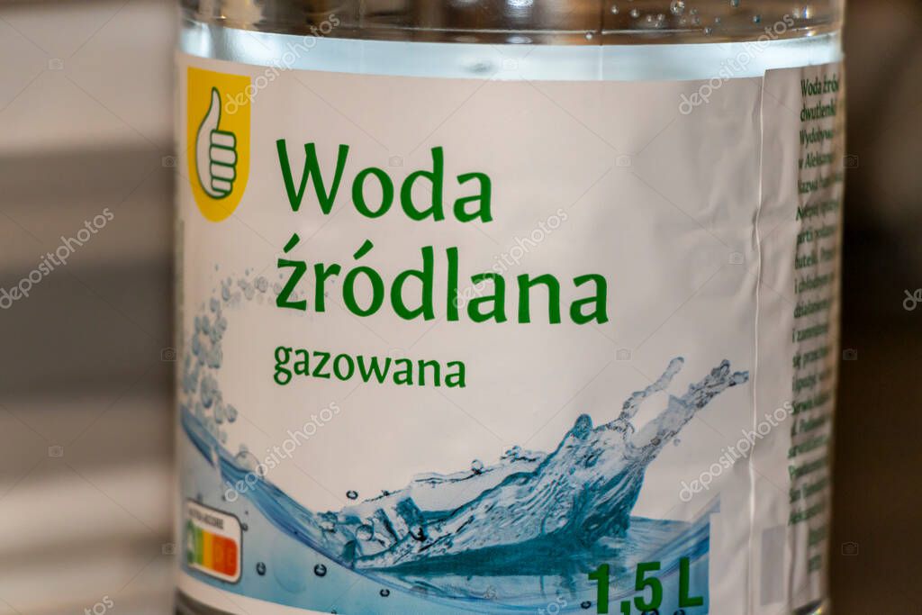 Warsaw Poland - September 24 2025: Close-up of a bottle label featuring sparkling spring water in a clear plastic container showcasing refreshing and bubbly qualities.